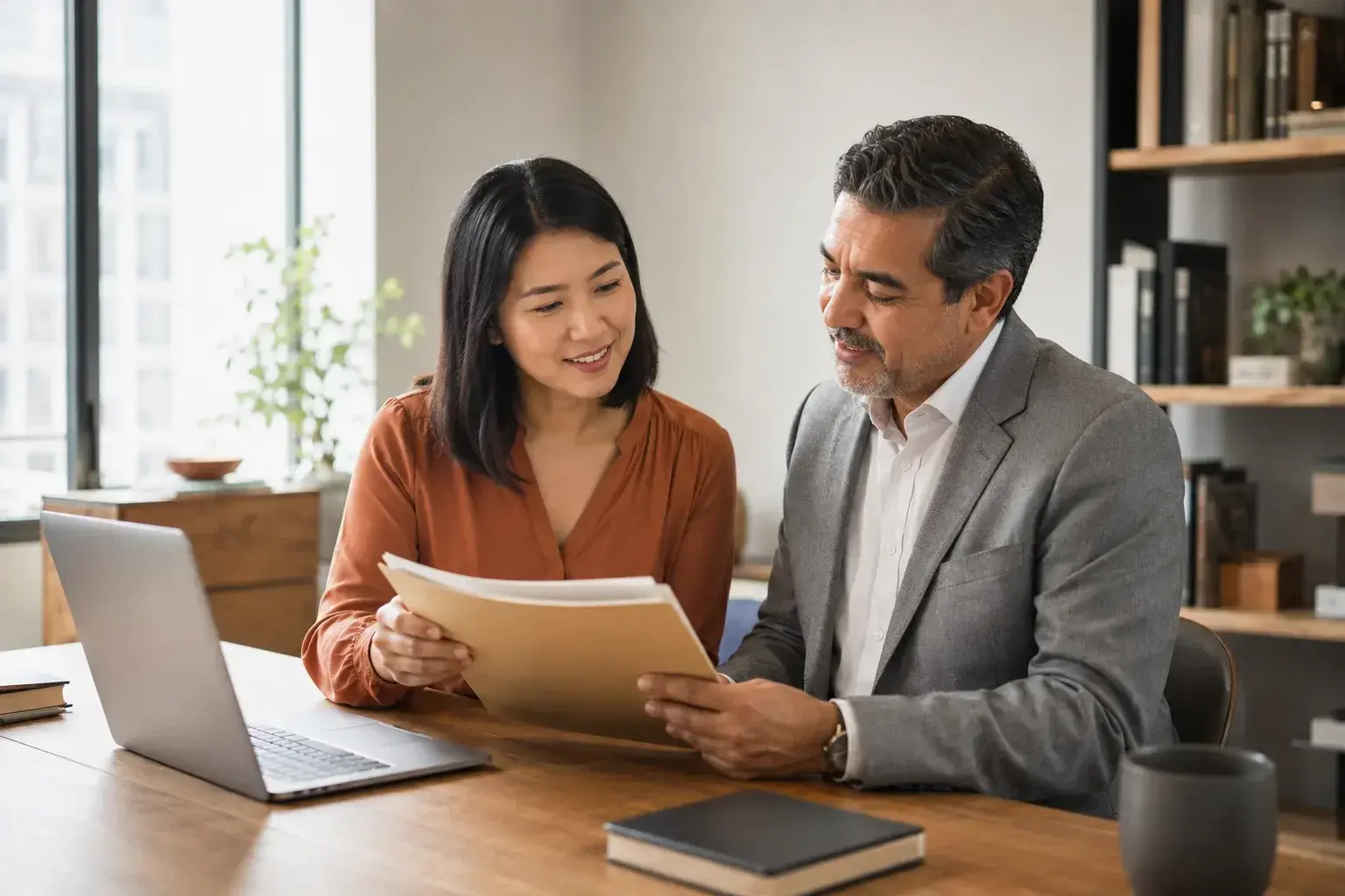Business owner discussing documents with an adviser